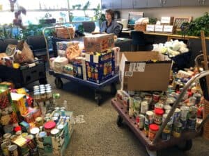 South Valley School Student Food Drive Is a Big Success Leaving Principal Bouillon Boxed in Her Office